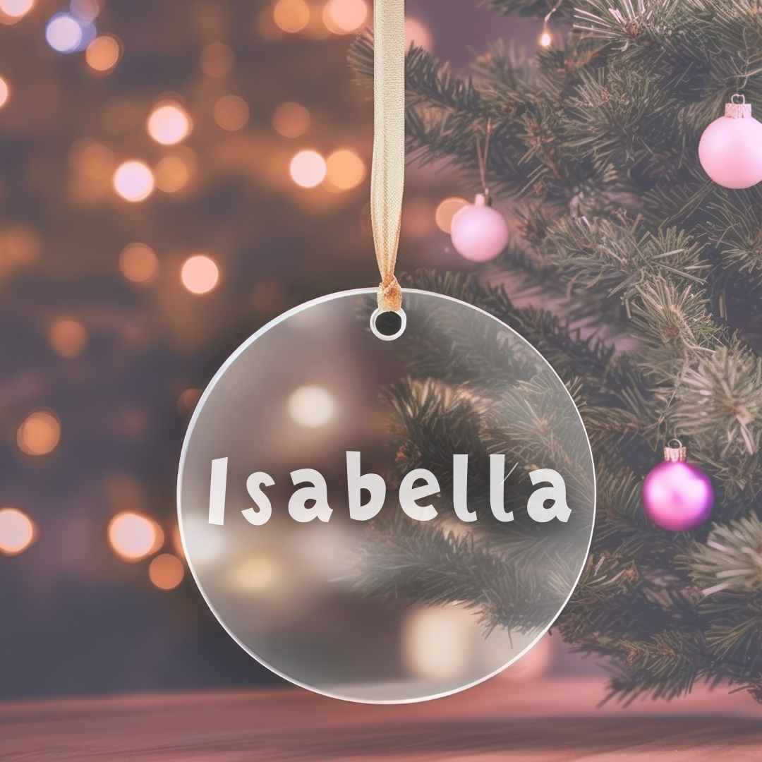 Christmas personalised bauble in clear, Isabella in white playful font.
